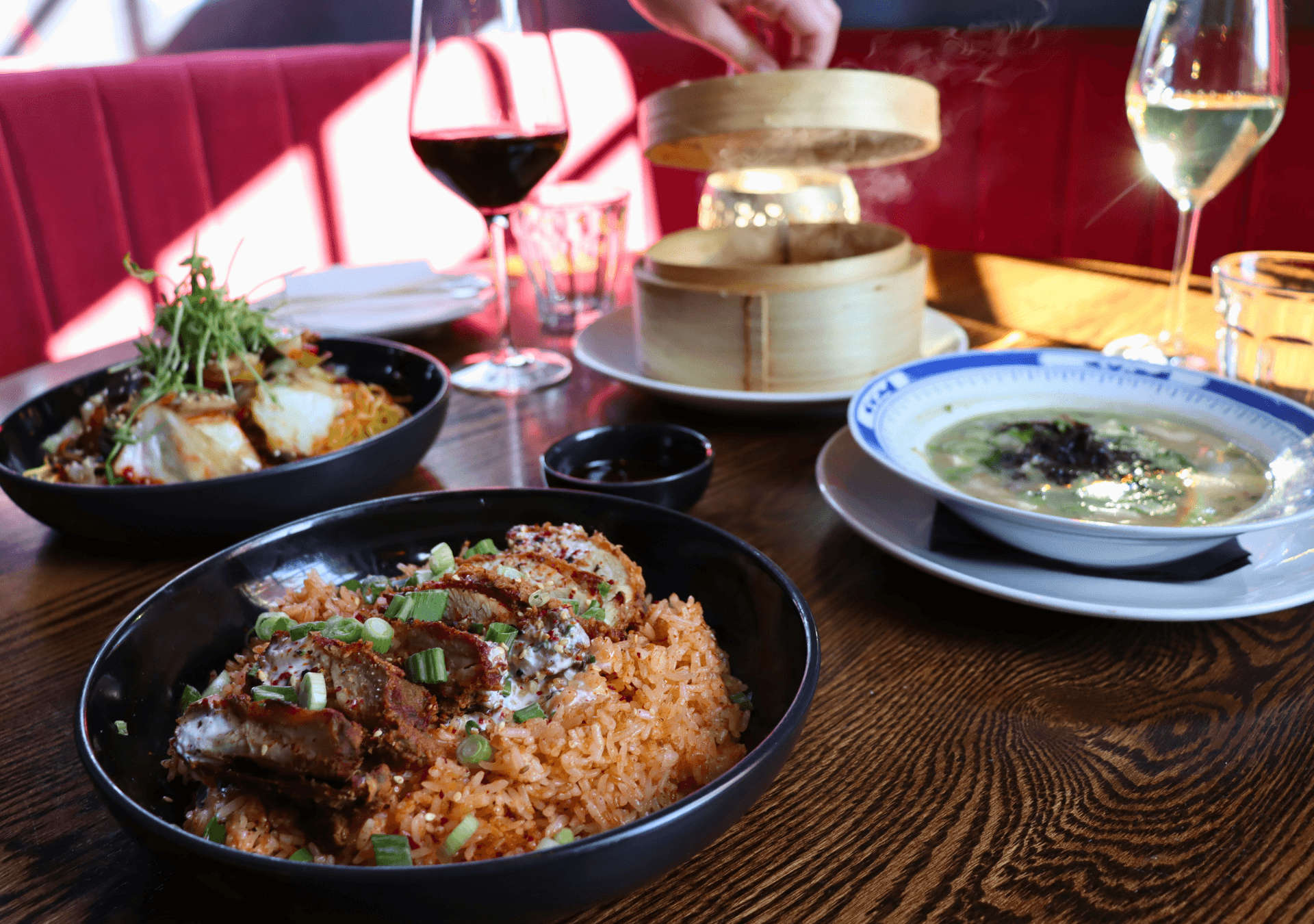 A table full of delicious asian-inspired dishes at Mother Tongue at Blue