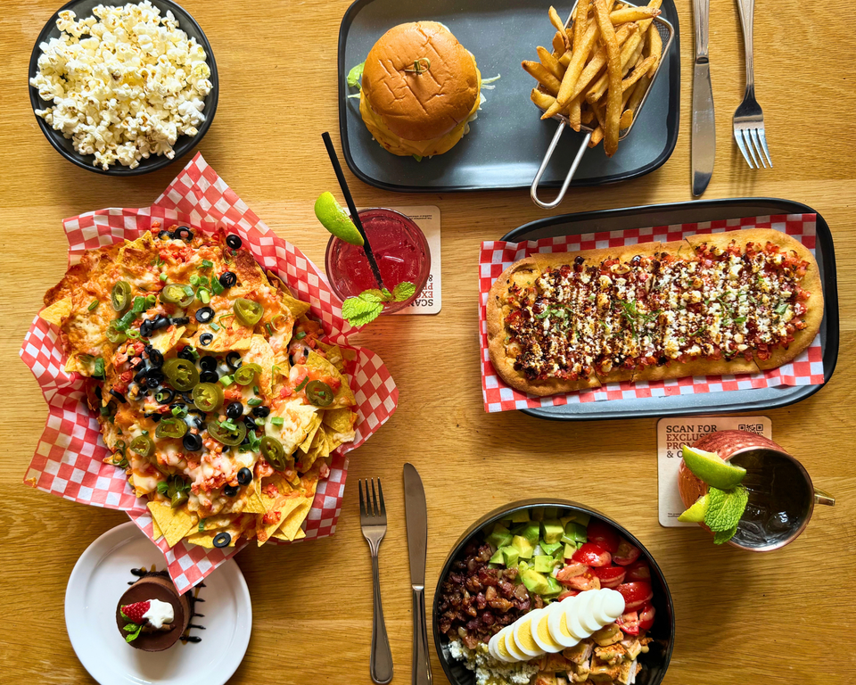 A beautiful aerial shot of a table full of colourful dishes and signature meals at Rusty's at Blue.