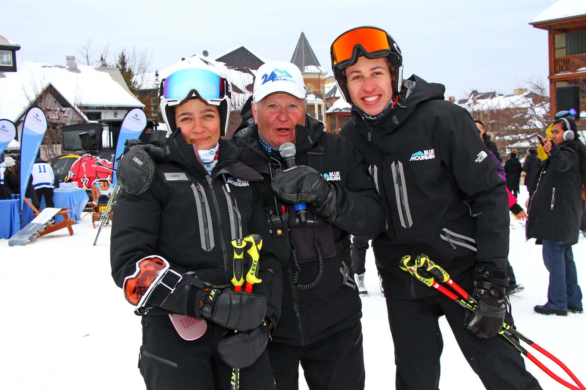 24h Blue Mtn host with posing with two participants he interviewed at the event.