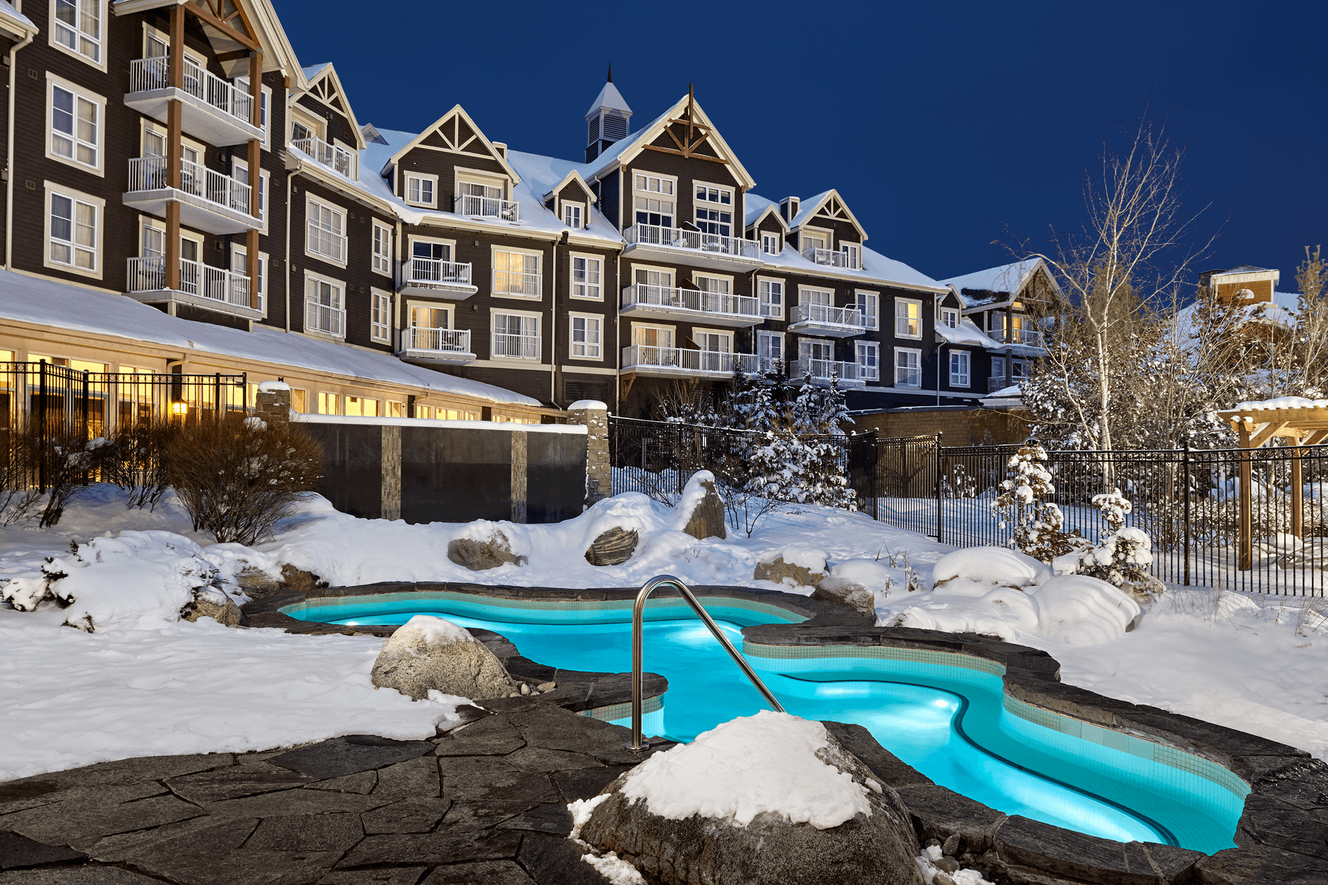 A stunning photo of the Westin hot tub covered in snow.