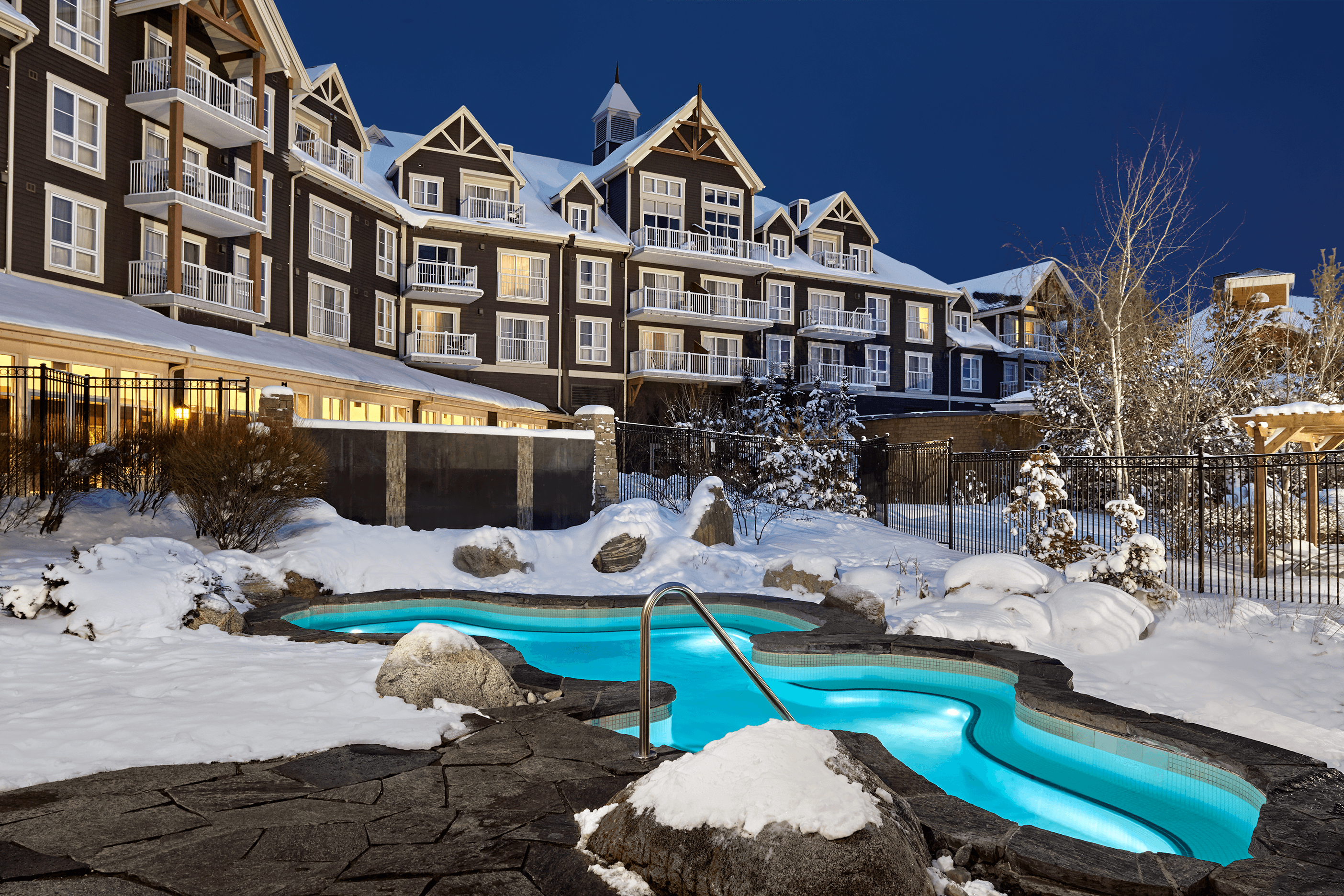 A stunning photo of the Westin hot tub covered in snow.