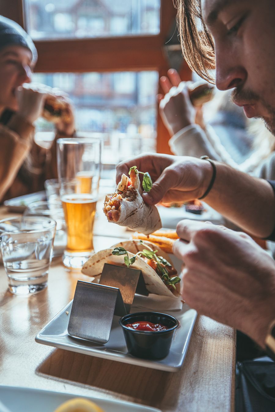 Group of friends dining at Copper Blues Bar & Grill for winter après fun.