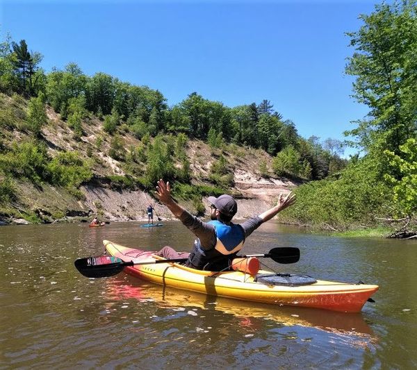 A man kayaking down a river with Free Spirit Tours.