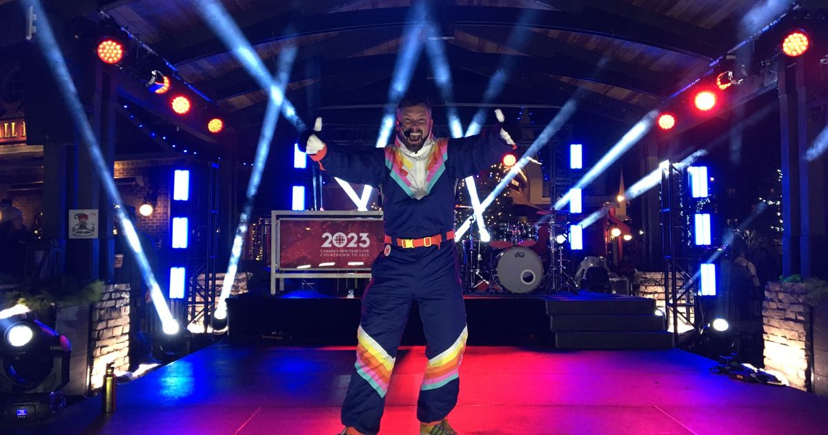 Local hype-man, Tyler Boyle, leads GLOW Groove Dancing on the Subaru Stage for New Year's Eve at Blue.