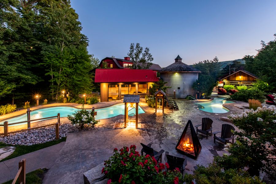 A scenic night shot of the Scandinave Spa pools.