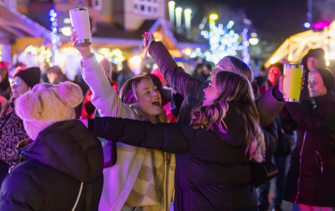 Friend group dancing and singing outside at Winter DJ Series