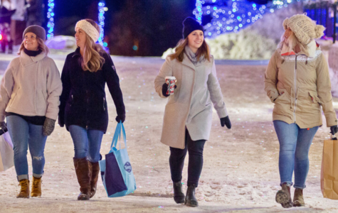 Girls dressed in winter clothing shopping