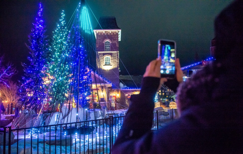 Guests capture photos of the spectacular light installations throughout the Village